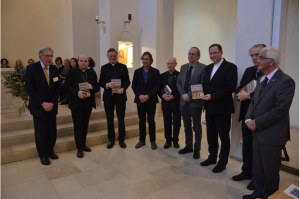 The five bishops with the book 'Het Mirakel van Amsterdam'